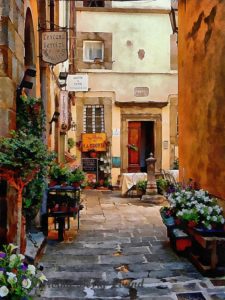 An example of ornate drinking water fountains in Italy can be seen in the rear section of this beautiful image of a floral courtyard in Cortona, Tuscany