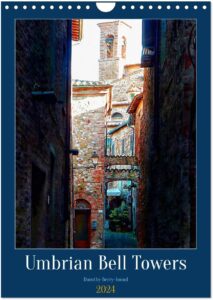 The front page of a calendar depicting a view down a dark Italian alley way towards a towering bell tower highlighted in sunshine. Has the words Umbrian Bell Towers, Dorothy Berry-Lound and 2024.