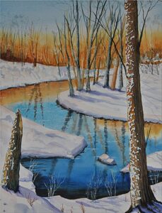A winter snow scene of a river with snowy banks and the skeletal trunks of tress reflected in the water