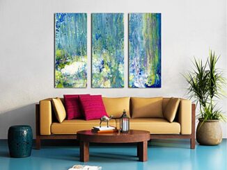 A living room setting with a three canvas panel split print on the wall, featuring a relaxing abstract painting in shades of blue, green, white and gold.